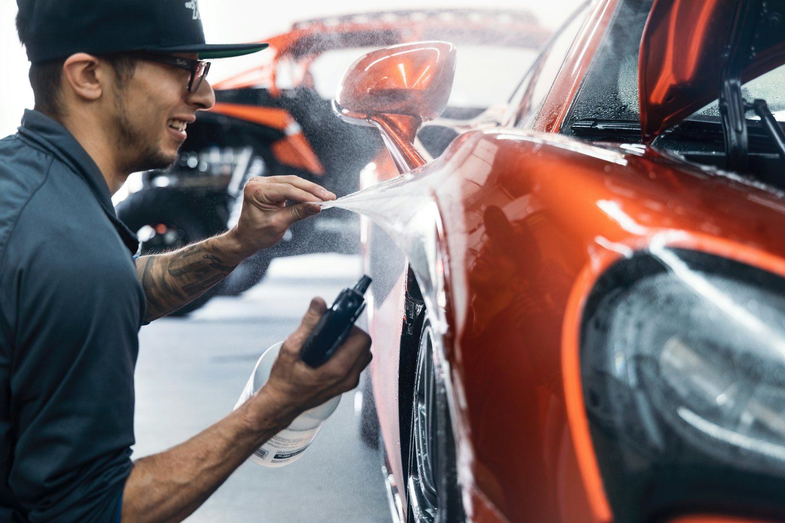 A technician finishing a body panel