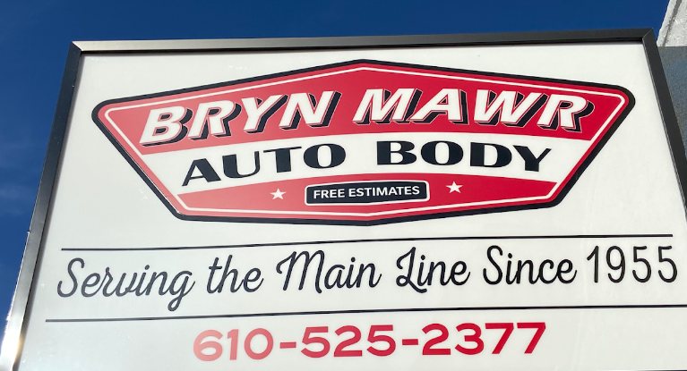 The Bryn Mawr Auto Body sign on West Haverford Road: Free Estimates, Serving the Main Line Since 1955, 610-525-2377